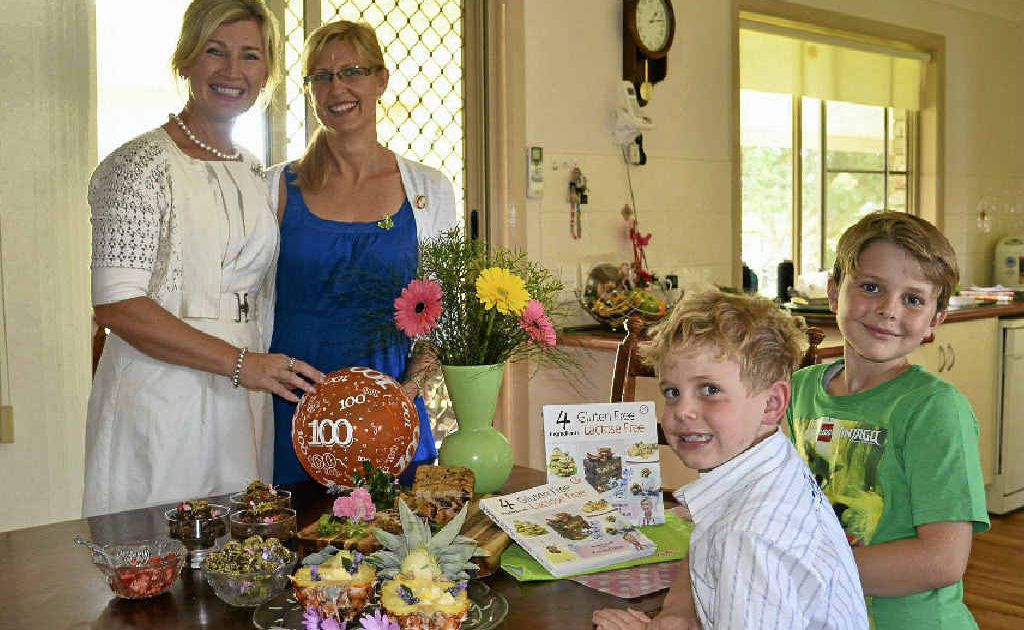 Stanthorpe-bred 4 Ingredients co-founder and director Kim McCosker with her cousin Rebecca Butler and two nephews, and biggest fans, Riley and Jakob, with a bunch of delicious gluten free, lactose free goodies.